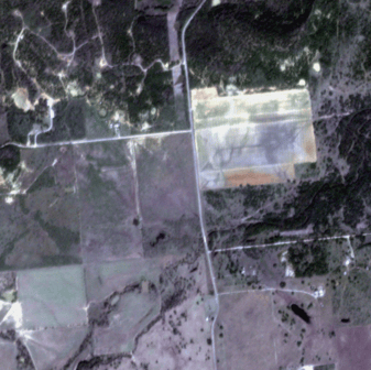 An aerial view of a farm</p>
<p>Description automatically generated